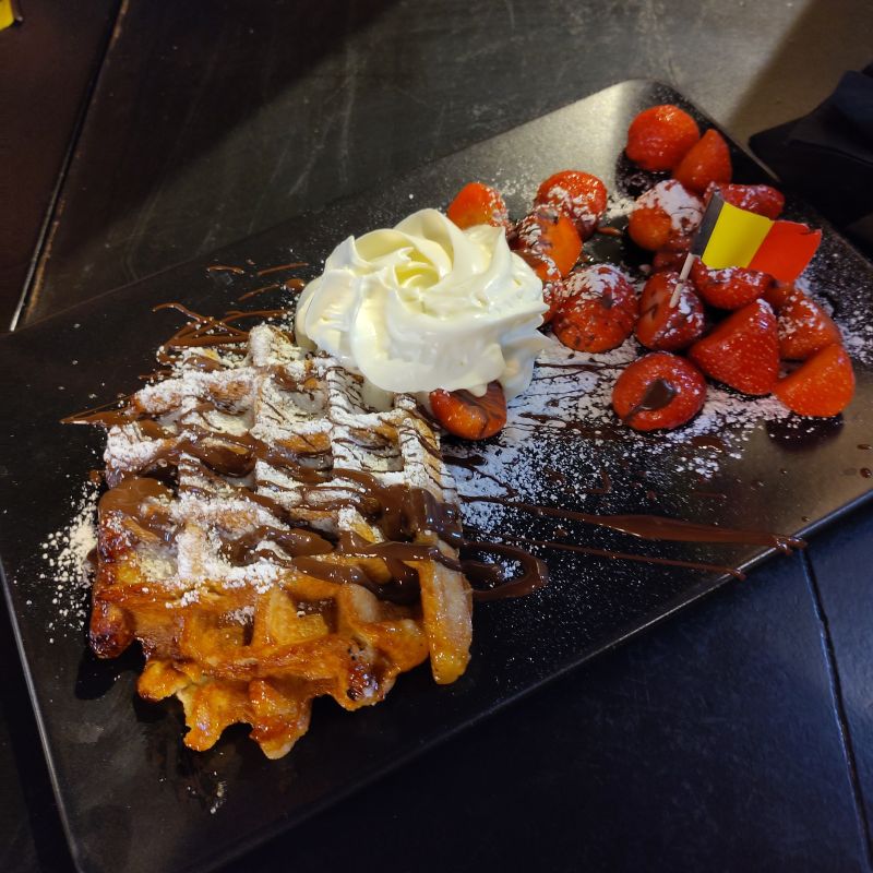 Waffle. Chocolate. Strawberries. Icing sugar. Cream. And a flag. That&rsquo;ll do it.